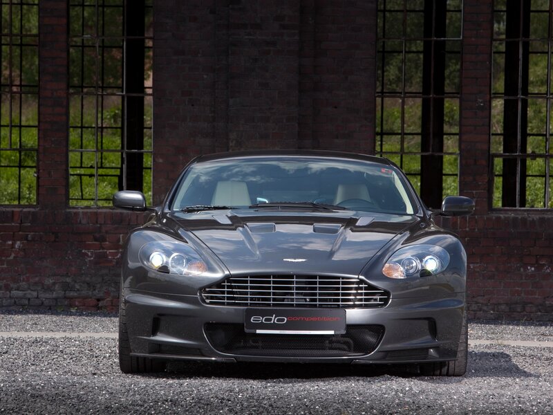 Aston Martin DBS in front of brick building