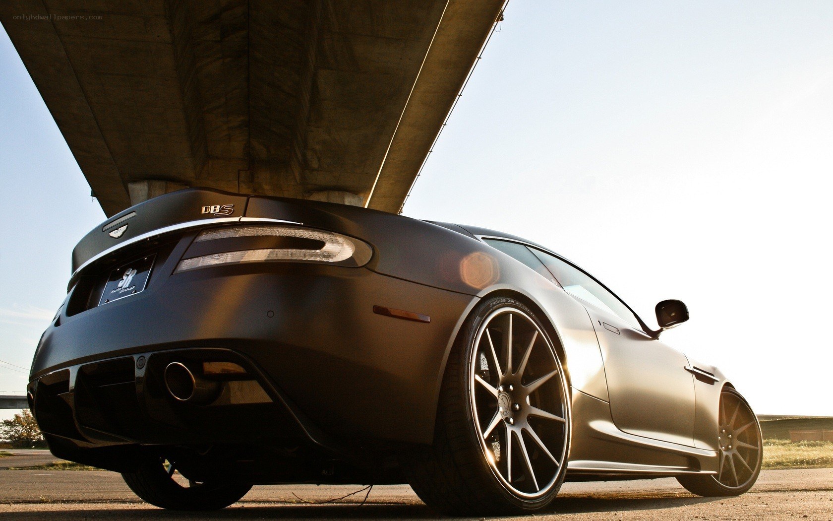 Aston Martin DBS under a bridge