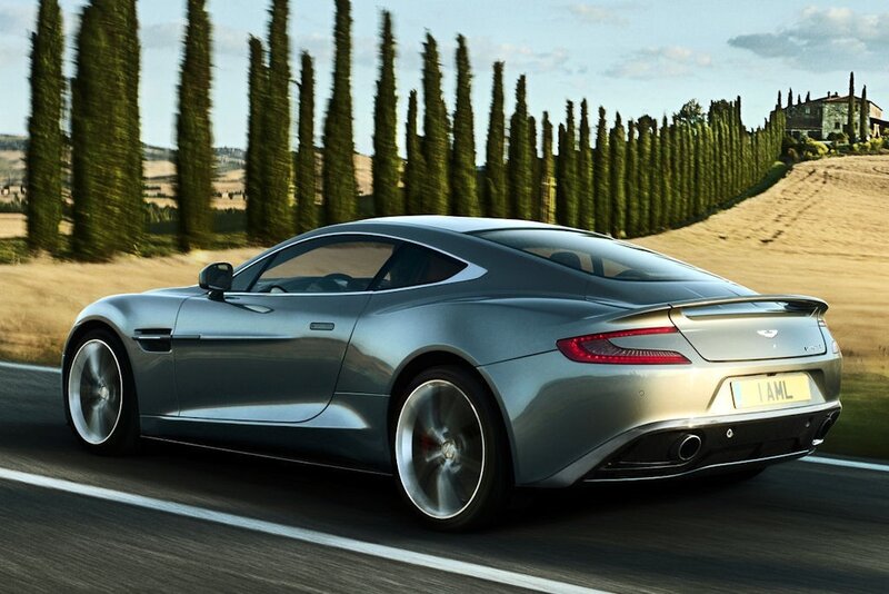 Aston Martin driving on a country road
