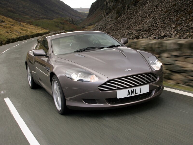 Aston Martin driving on a mountain road