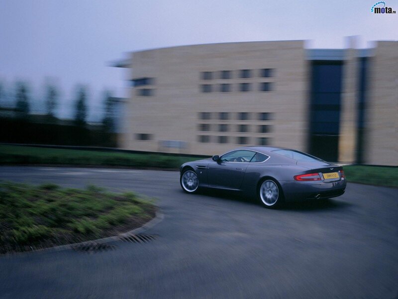 Aston Martin driving on a road