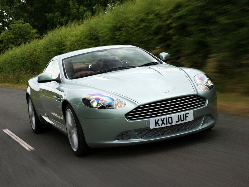 Aston Martin driving on a road