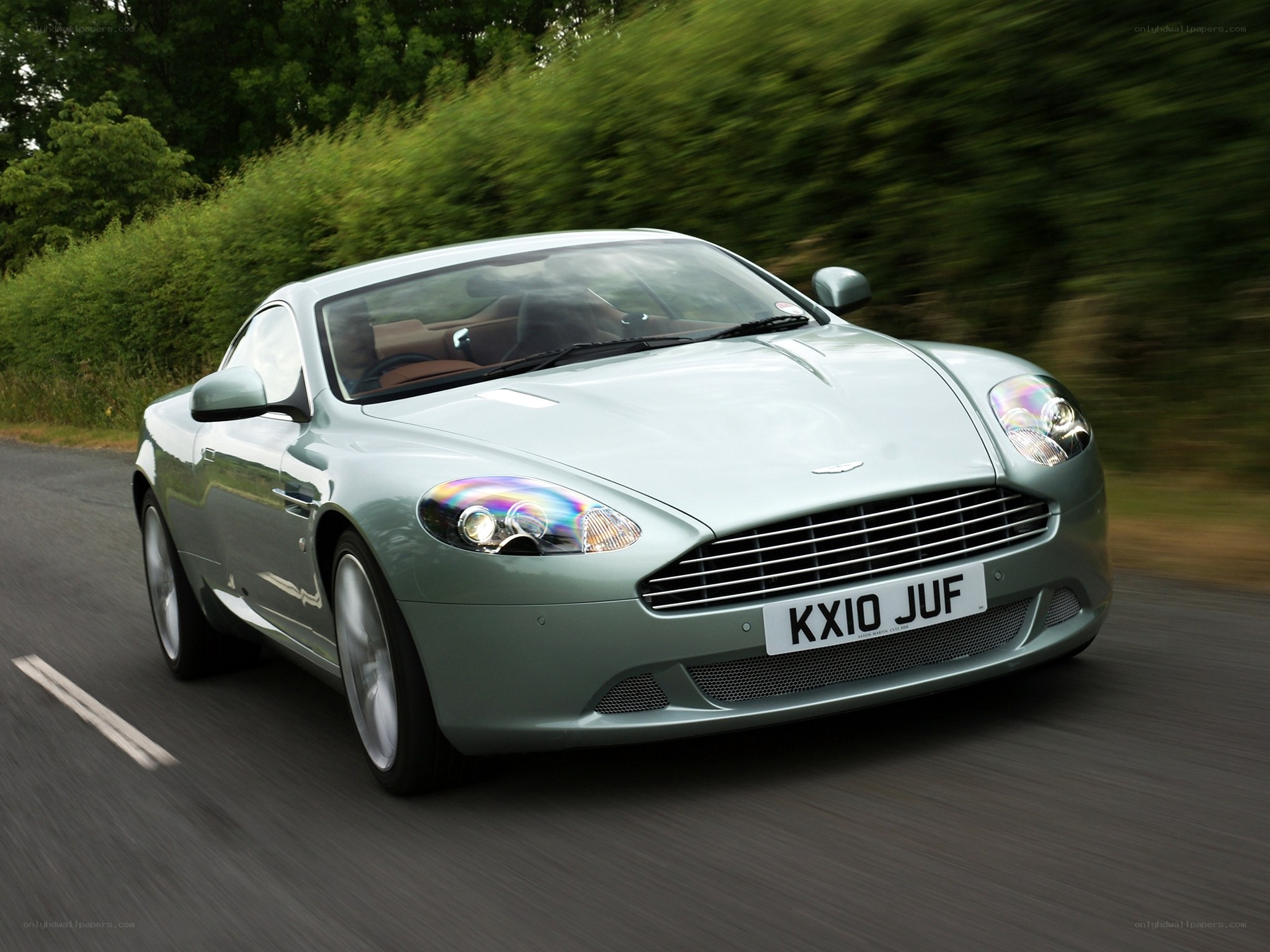 Aston Martin driving on a road