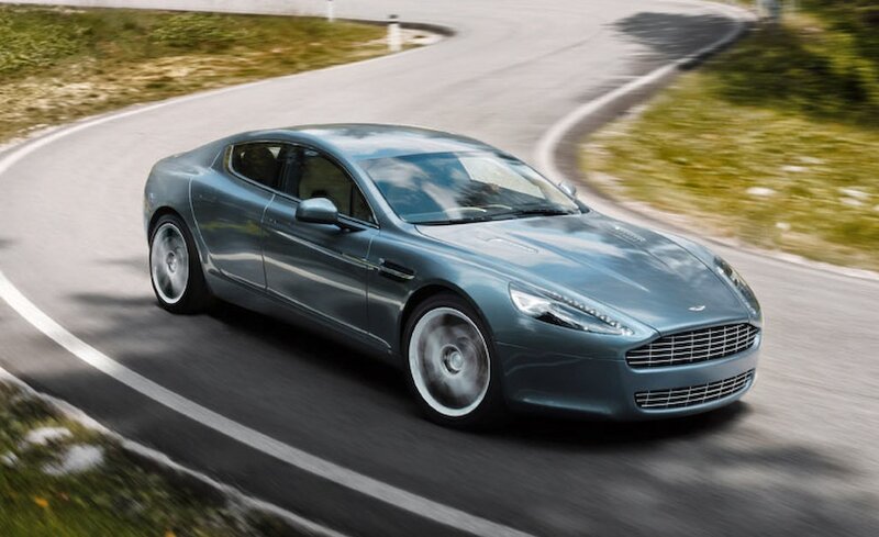 Aston Martin driving on a winding road