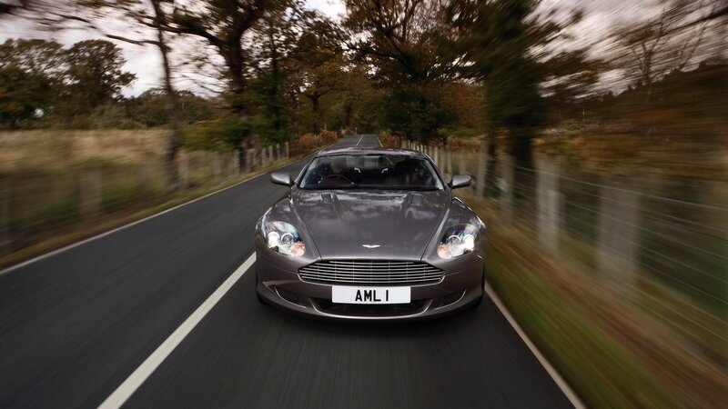 Aston Martin driving on country road