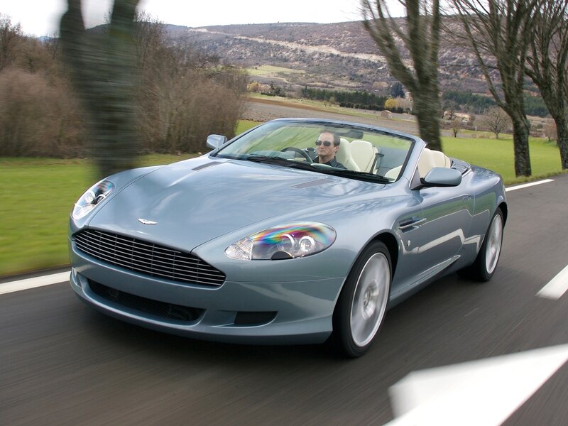 Aston Martin driving on country road