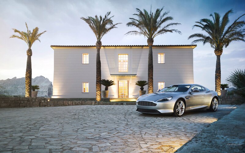 Aston Martin in front of a villa