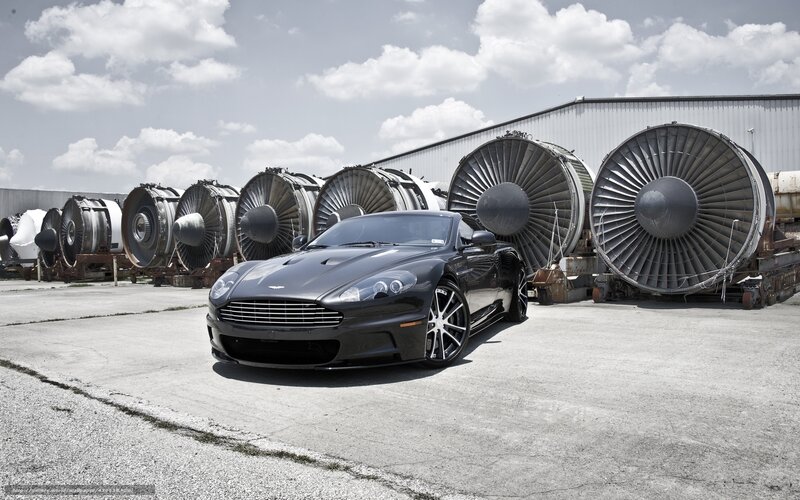 Aston Martin in front of jet engines