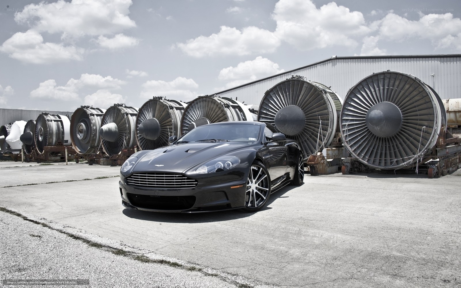 Aston Martin in front of jet engines