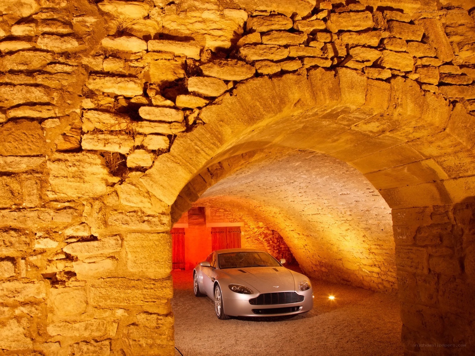 Aston Martin in stone tunnel