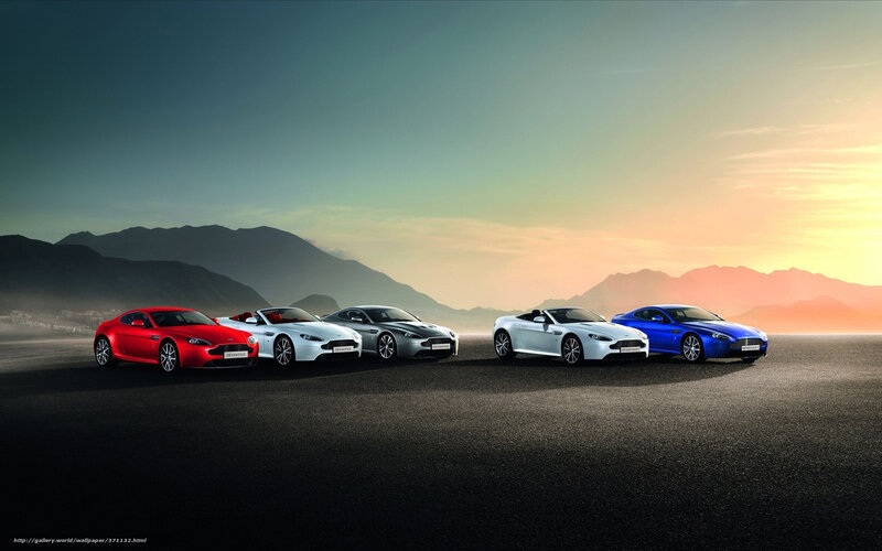 Aston Martin lineup at sunset
