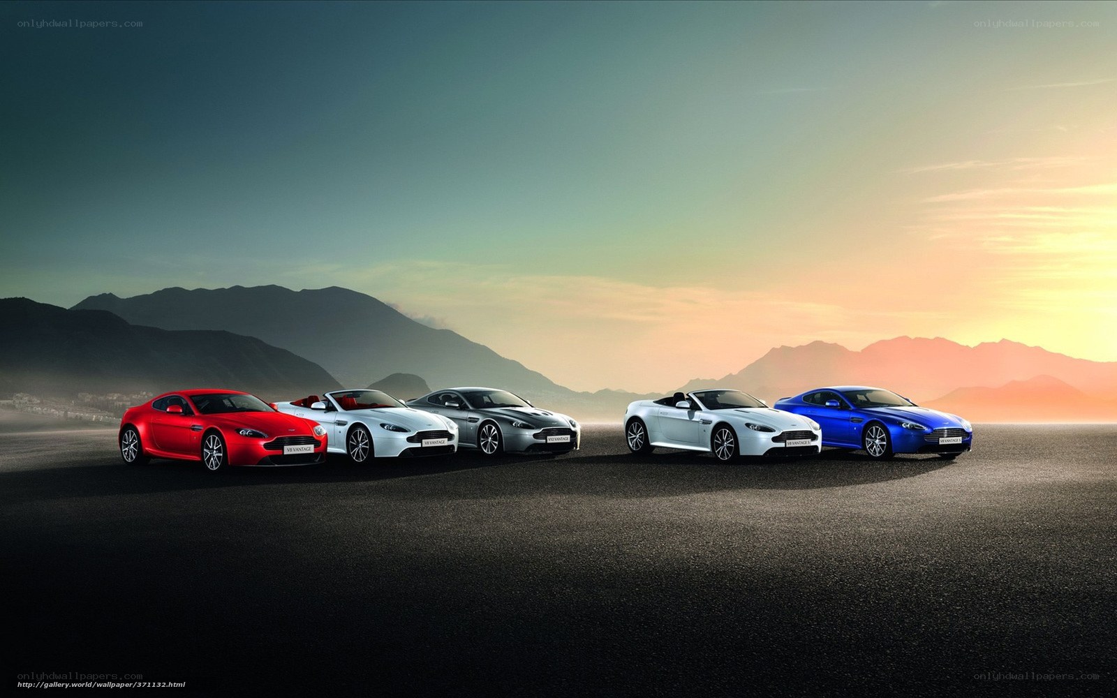Aston Martin lineup at sunset