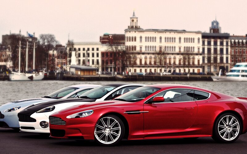 Aston Martin lineup by the water