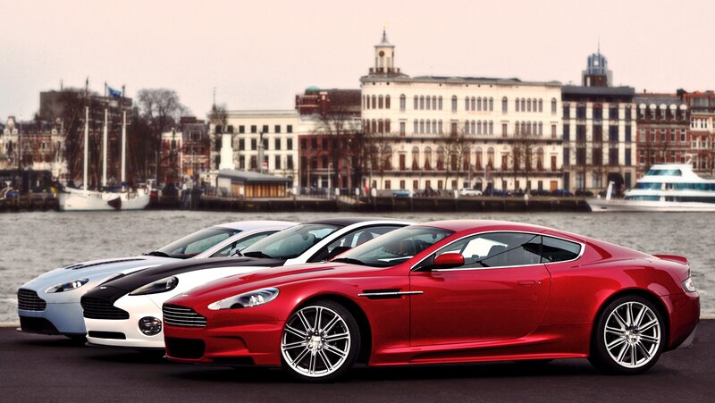 Aston Martin lineup by the water