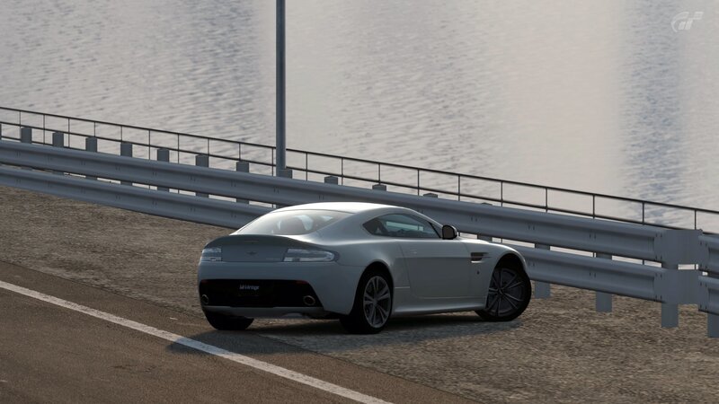 Aston Martin on a coastal road