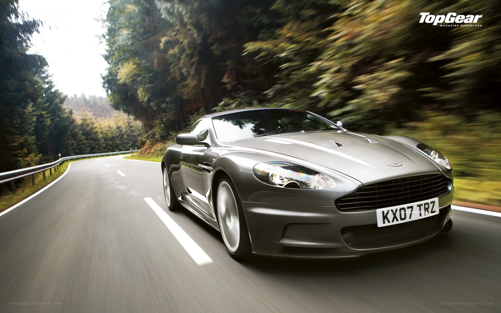 Aston Martin on a forest road