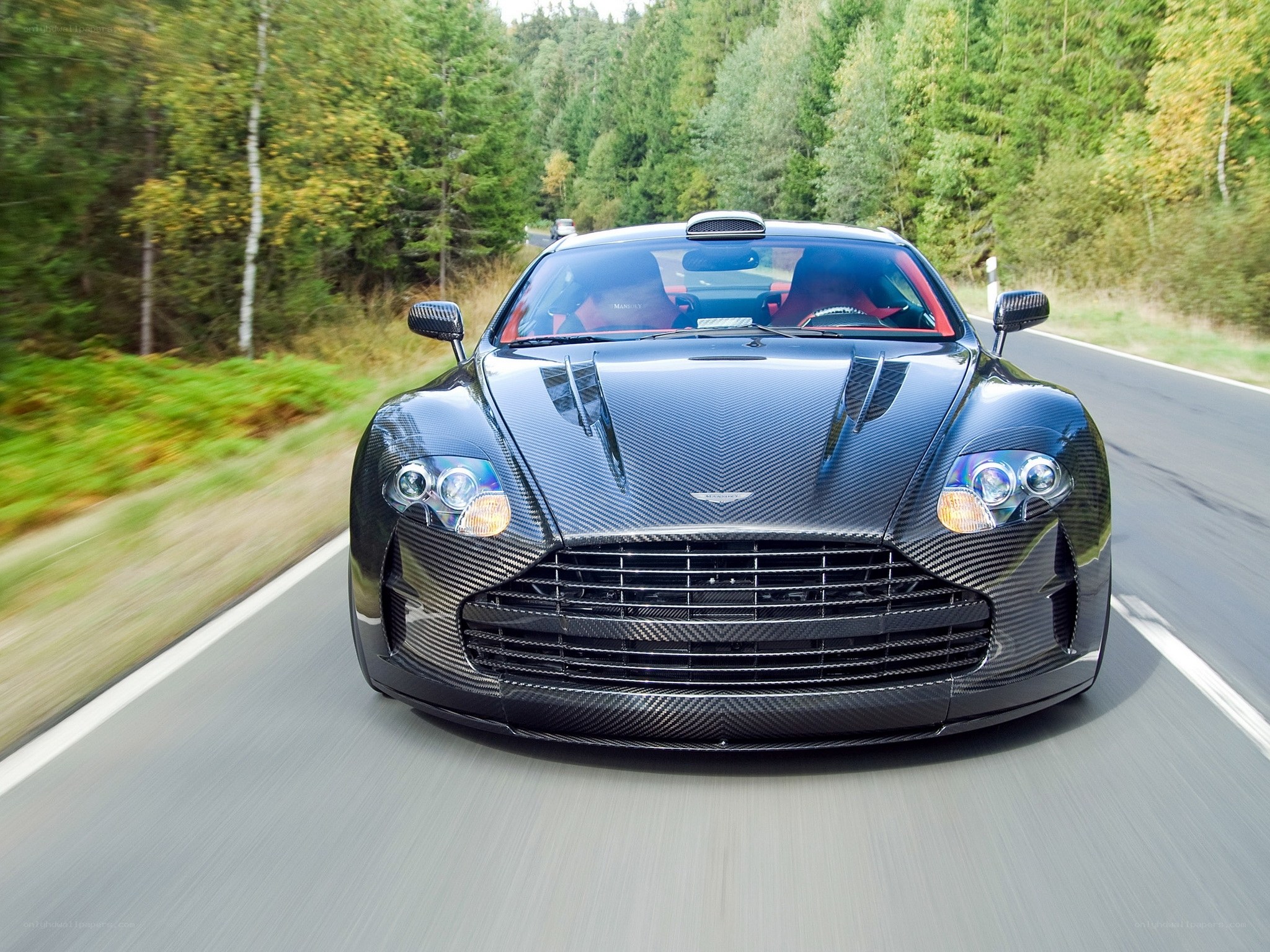 Aston Martin on a forest road