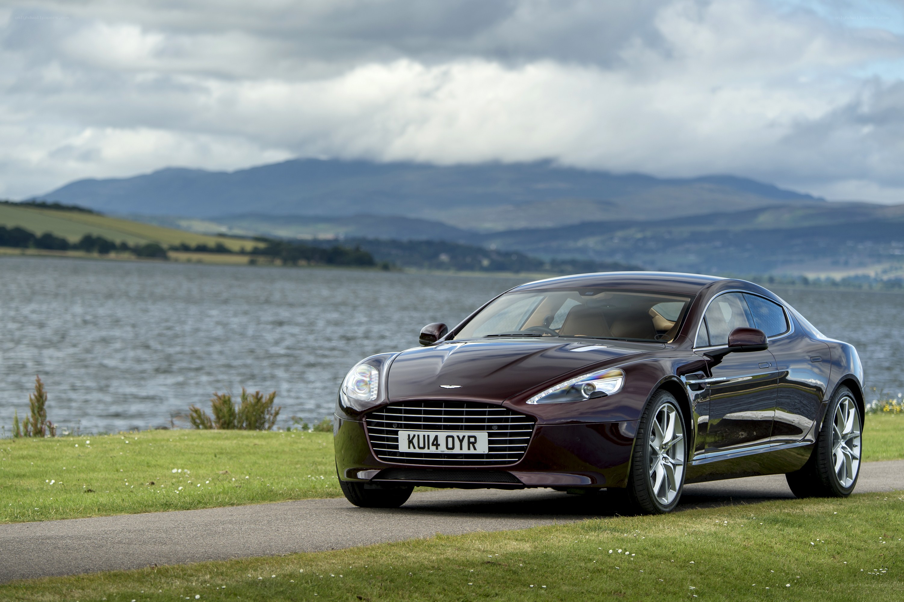 Aston Martin on a lakeside road