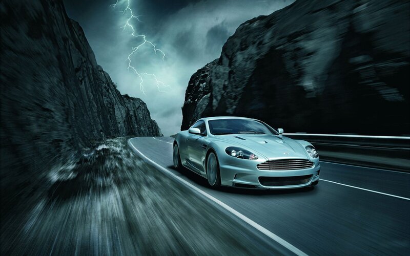 Aston Martin on a stormy mountain road