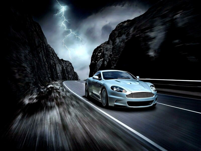 Aston Martin on a stormy mountain road