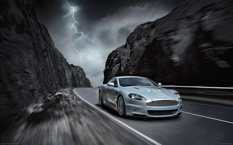 Aston Martin on a stormy mountain road