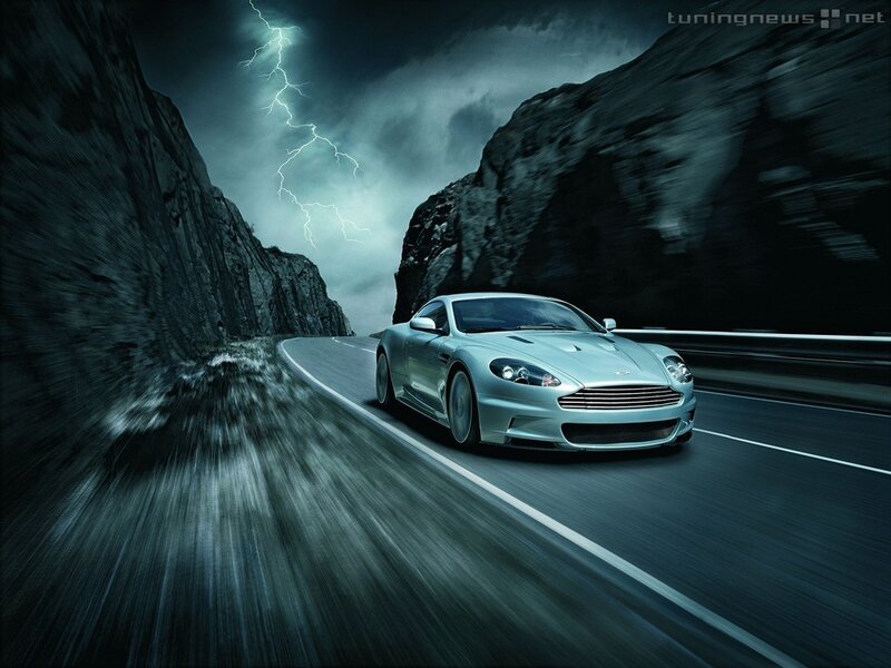 Aston Martin on a stormy road
