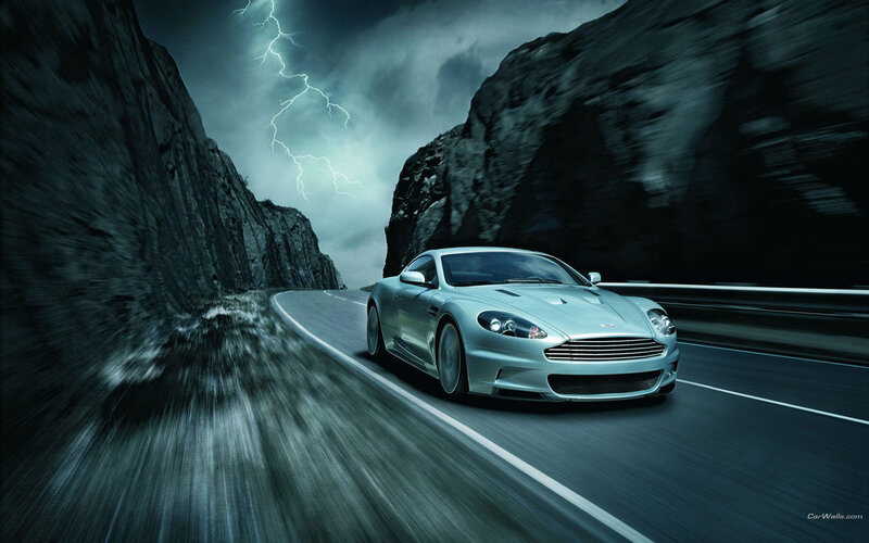 Aston Martin on a stormy road