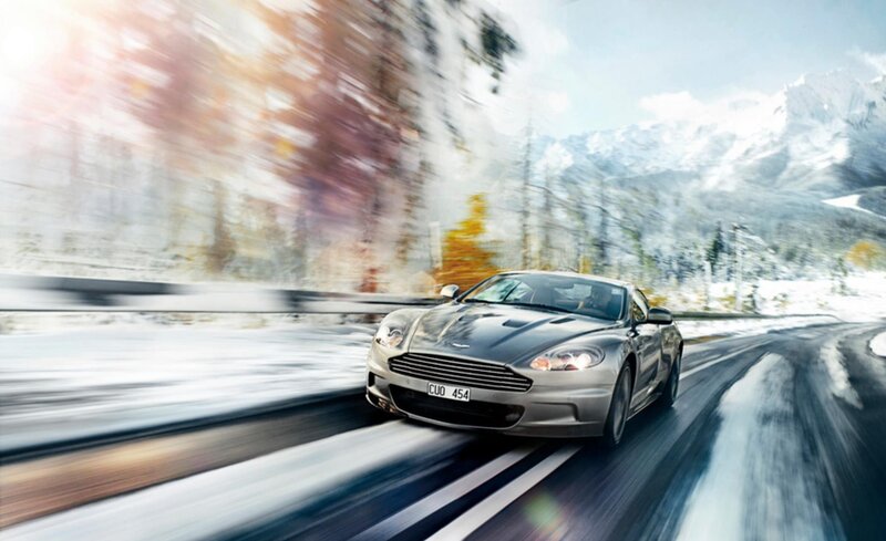 Aston Martin on snowy mountain road