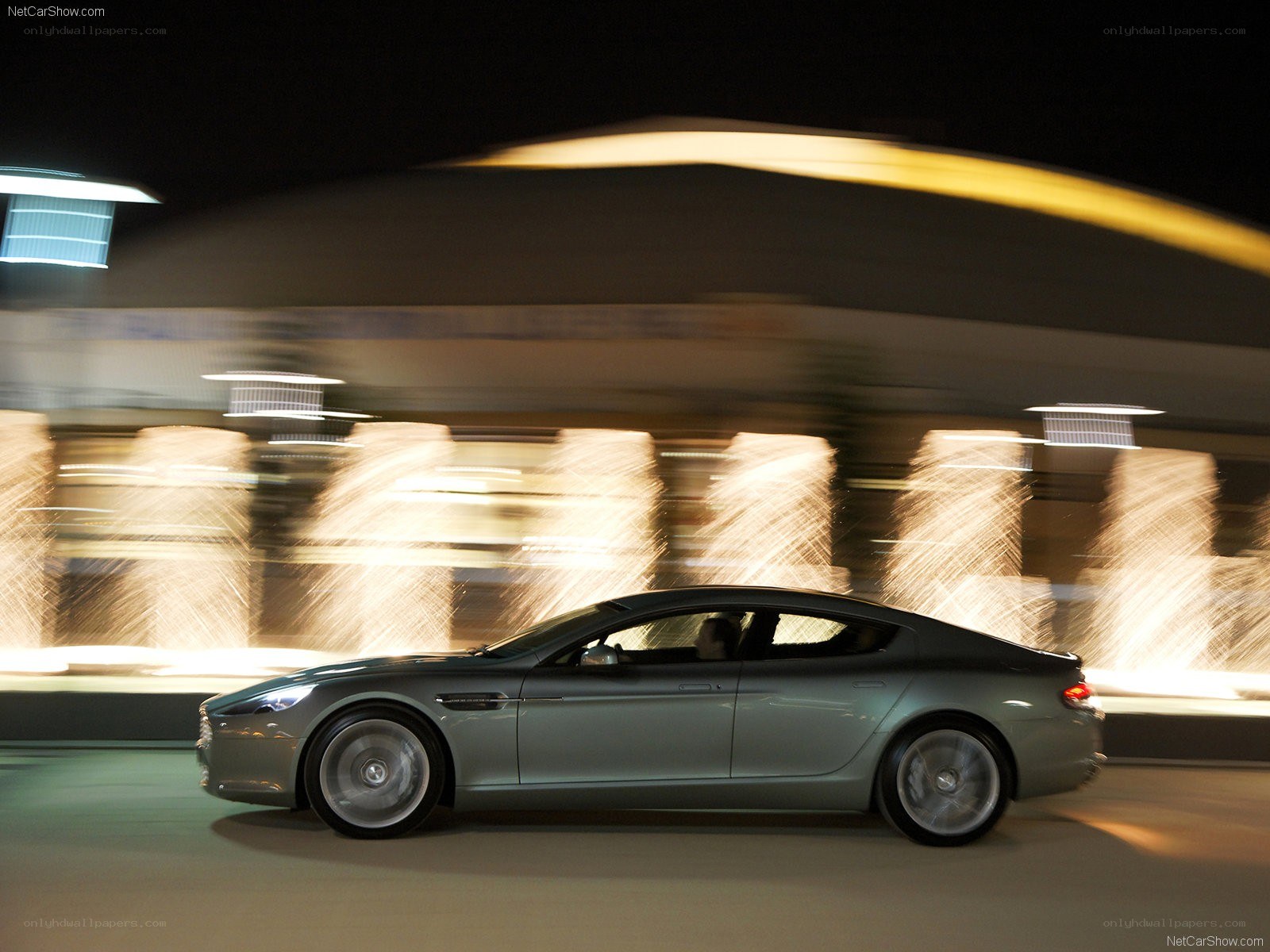 Aston Martin passing at night