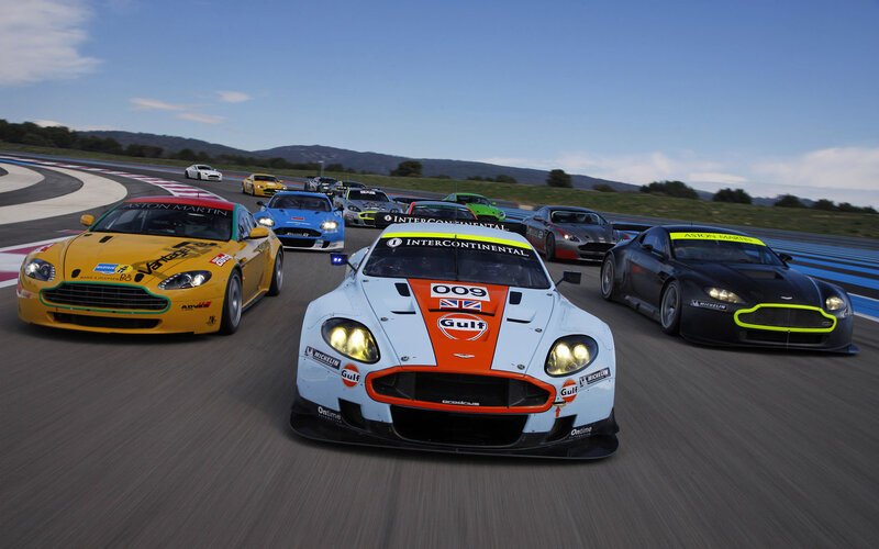 Aston Martin race cars on track