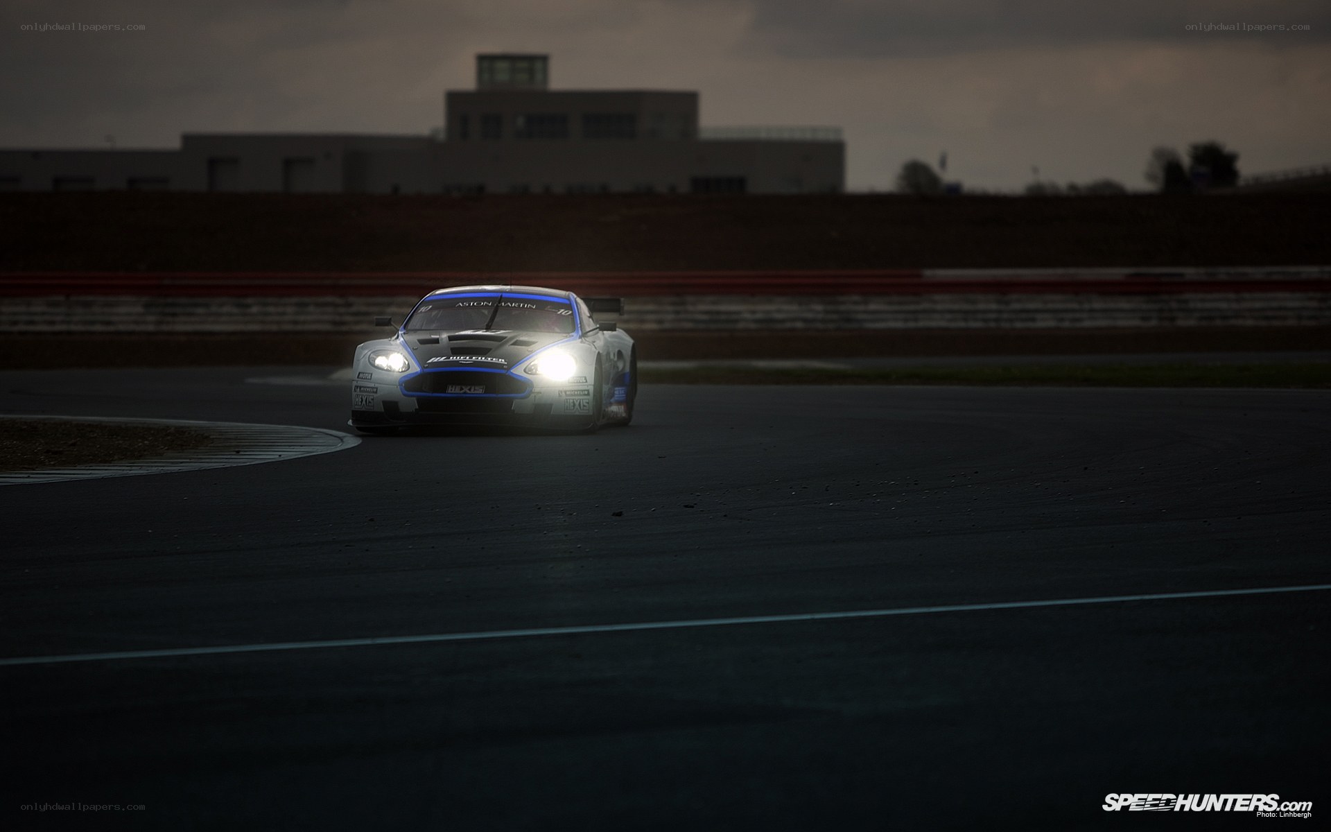Aston Martin racing at dusk