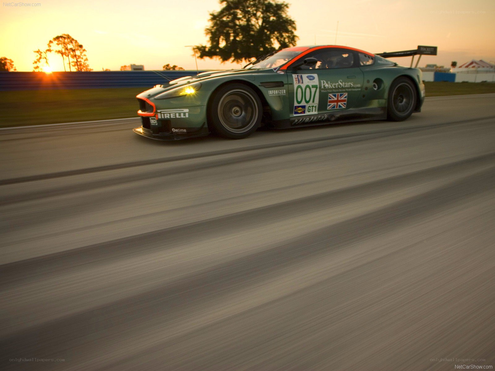 Aston Martin racing at sunset