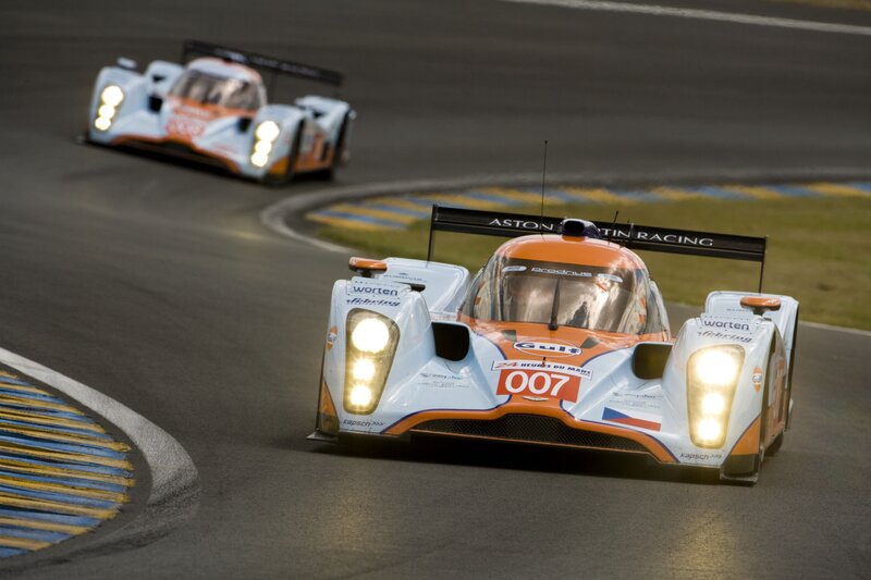 Aston Martin racing cars on track