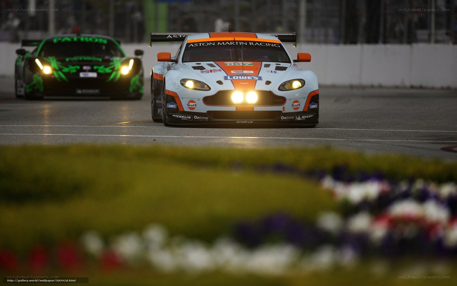 Aston Martin racing cars on track