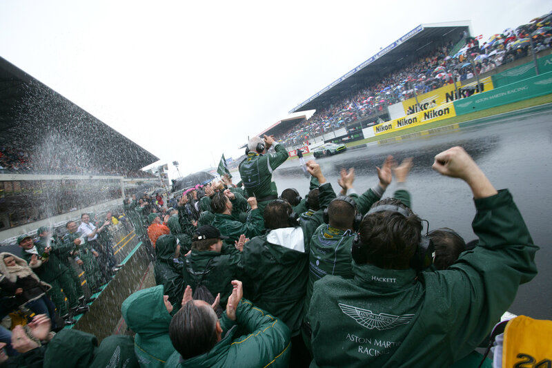 Aston Martin team celebrates in rain