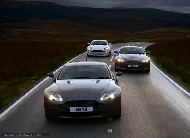 Aston Martin V8 cars on a road