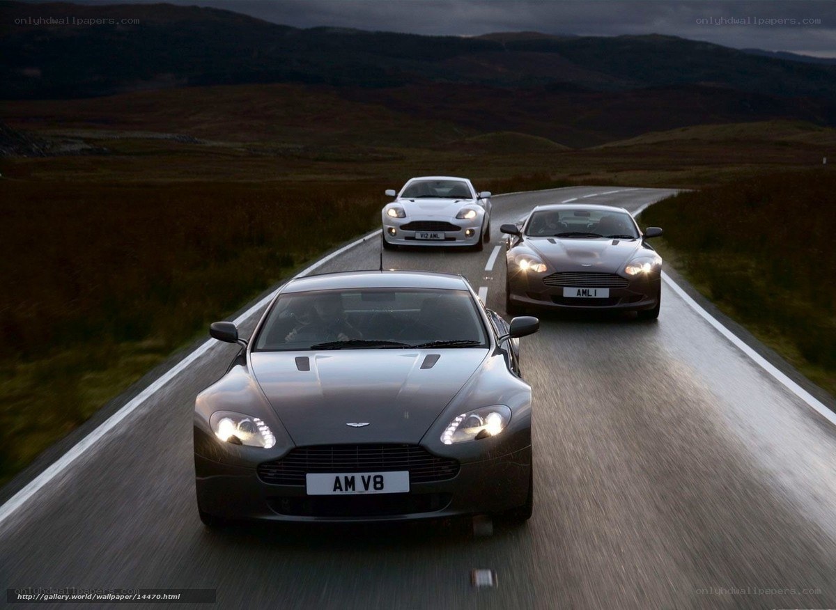 Aston Martin V8 cars on a road