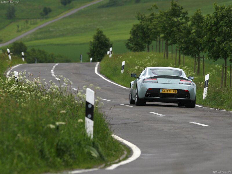 Aston Martin V8 on a winding road