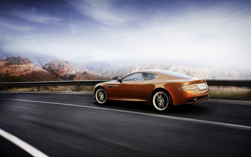 Aston Martin Virage on a mountain road
