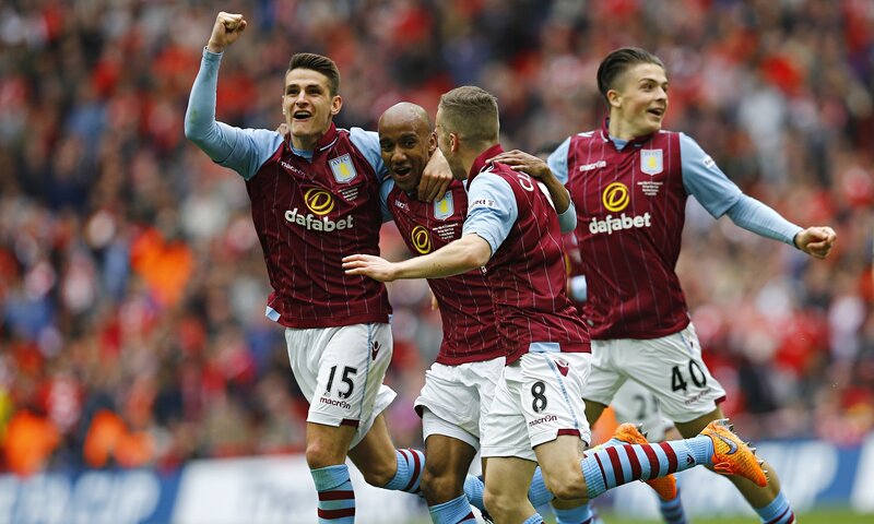 Aston Villa players celebrate a goal