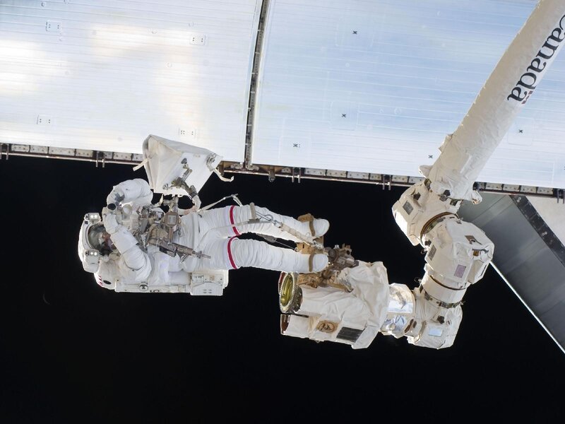 Astronaut During Spacewalk — White, Dramatic