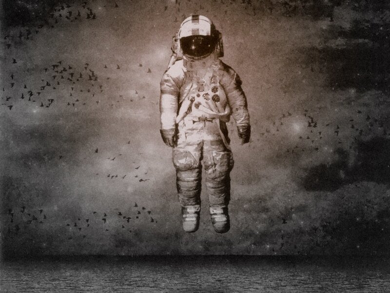 astronaut floating in mist
