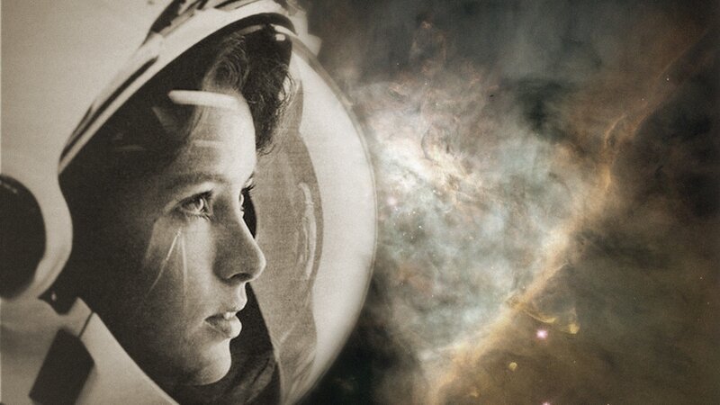 astronaut gazing at nebula