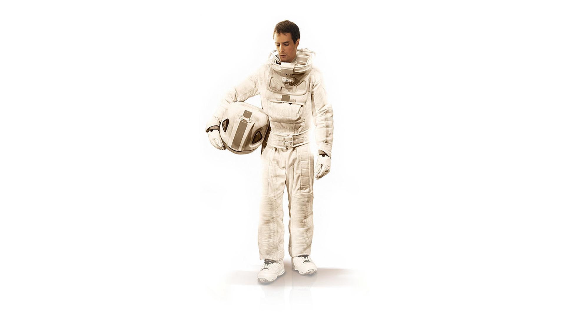 astronaut holding helmet