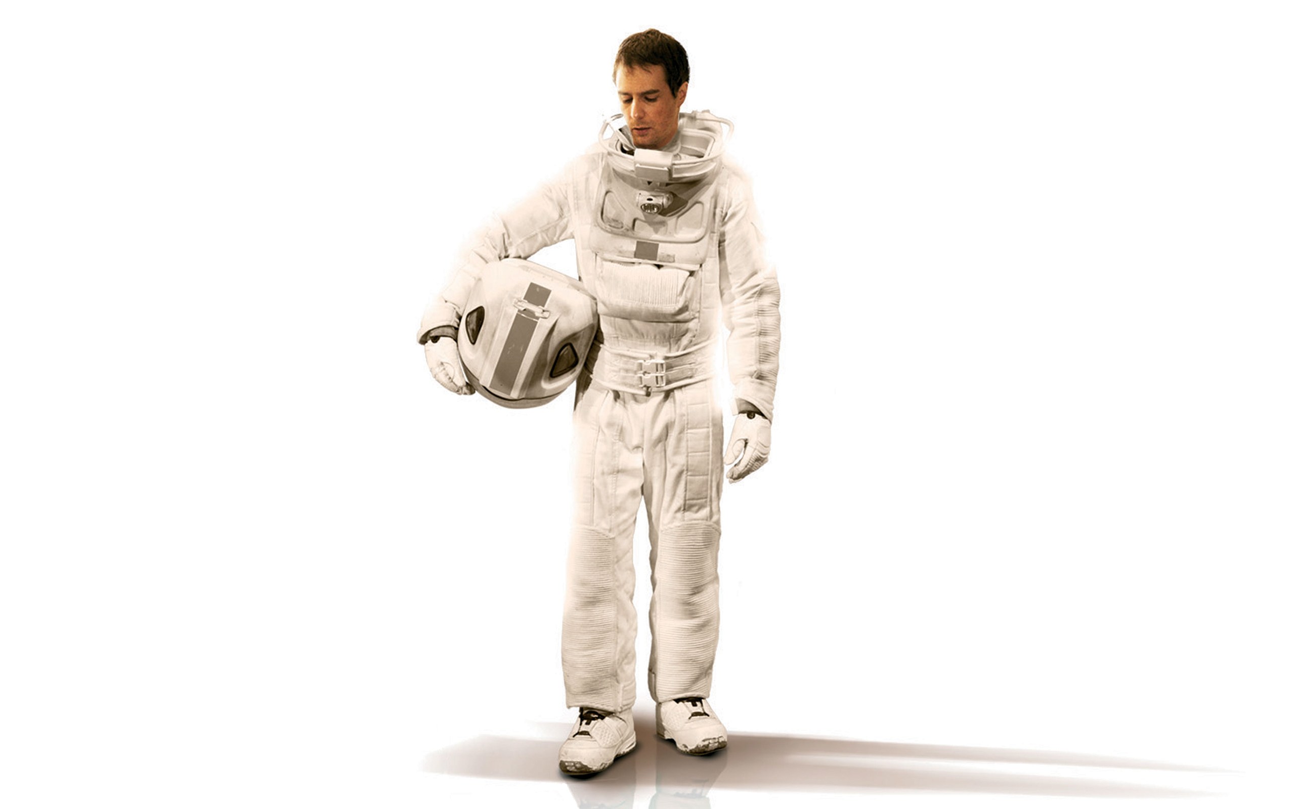 astronaut holding helmet