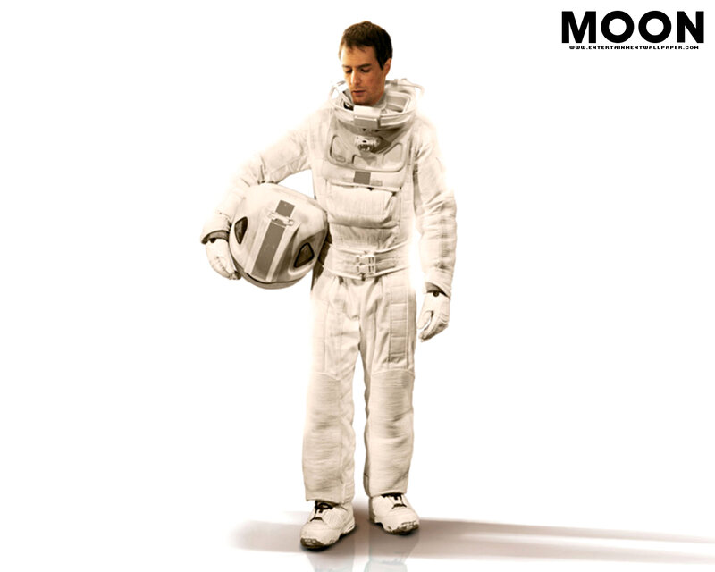 Astronaut holding helmet