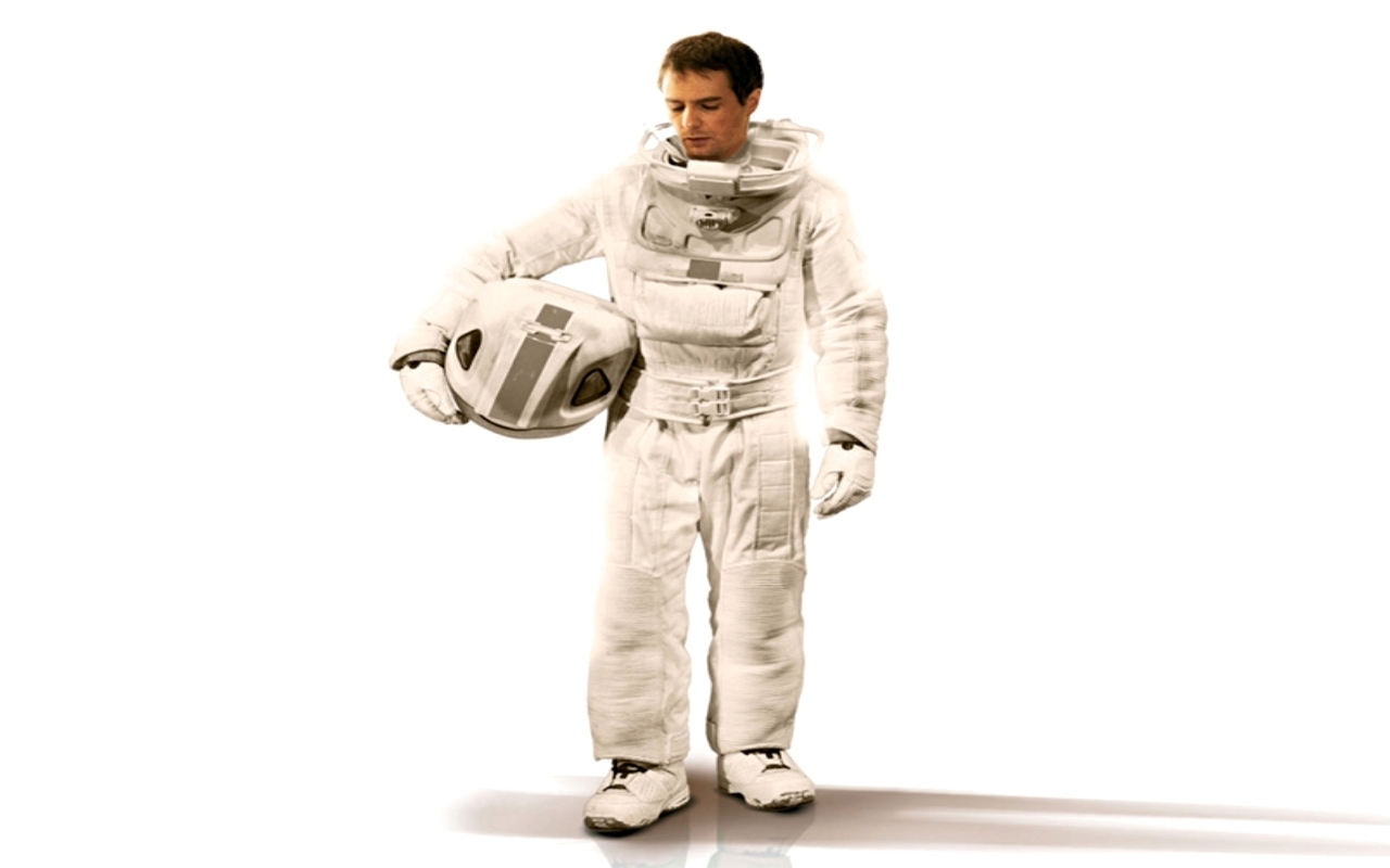 astronaut holding helmet