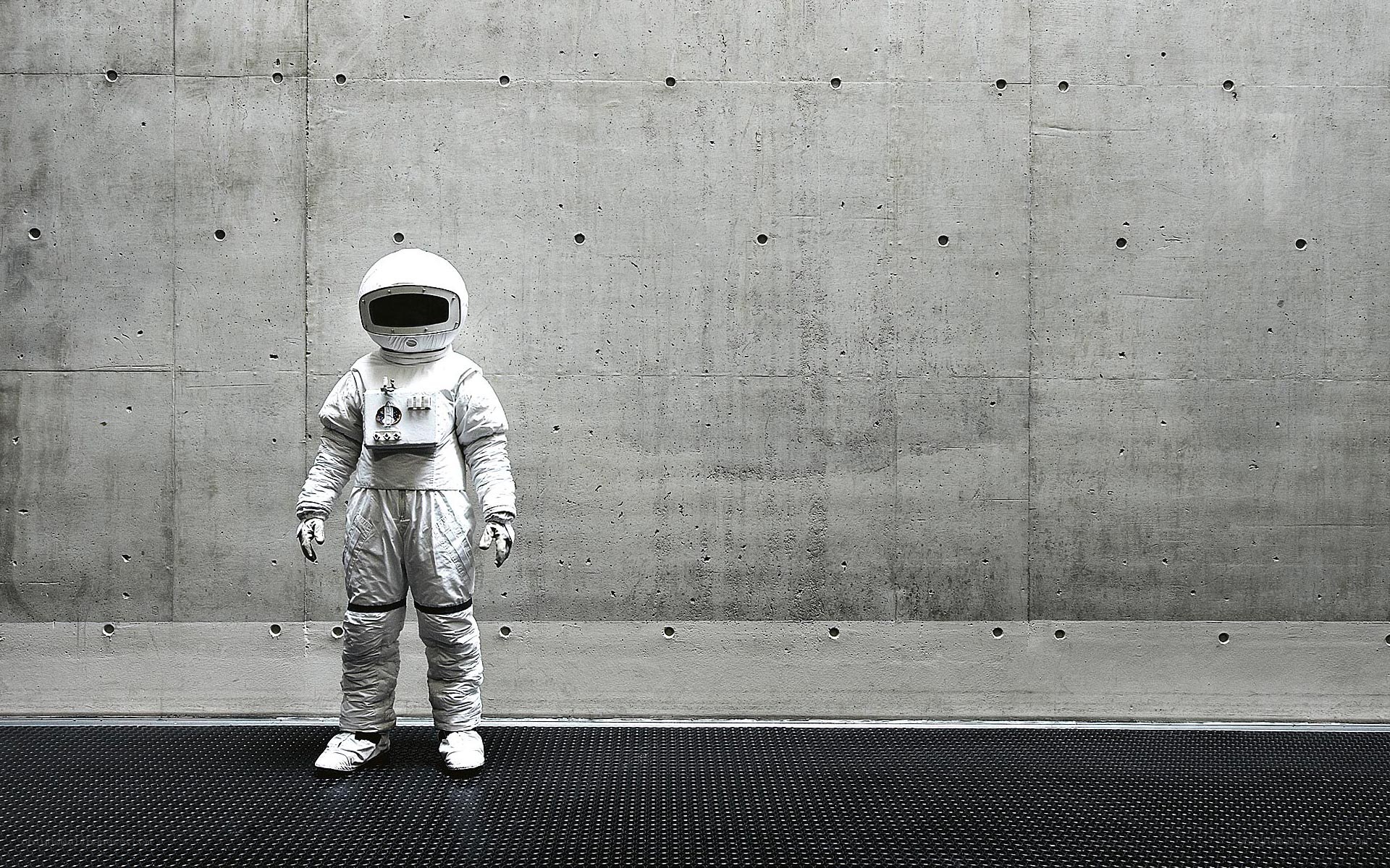 astronaut in concrete room