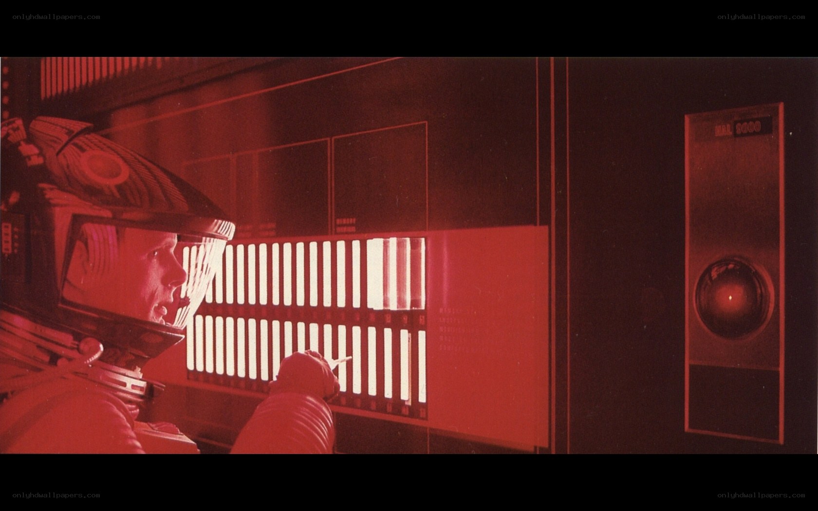 astronaut in red-lit cabin