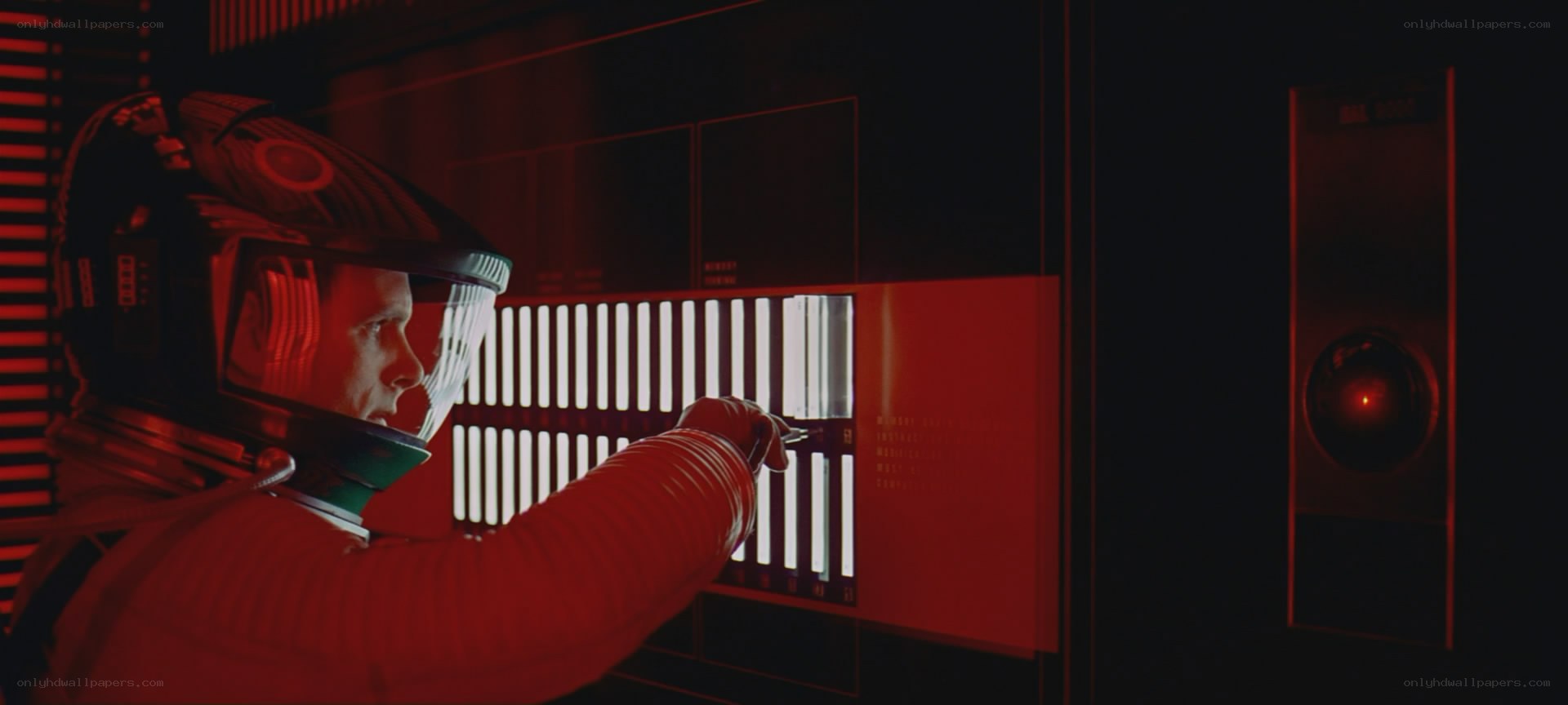 astronaut in red-lit control room